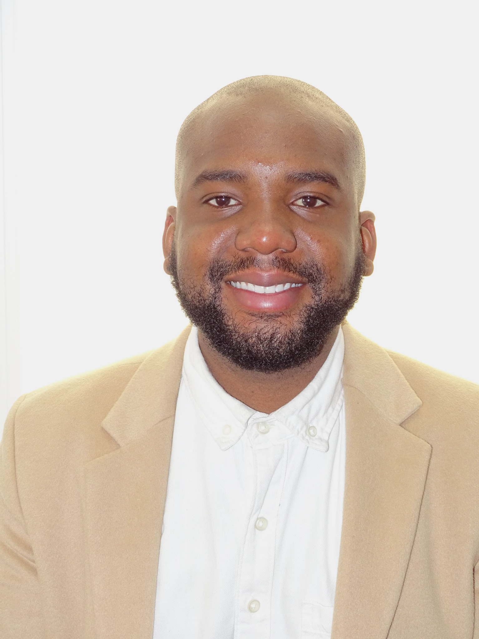 Portrait of the SEO service provider wearing a tan jacket and white shirt